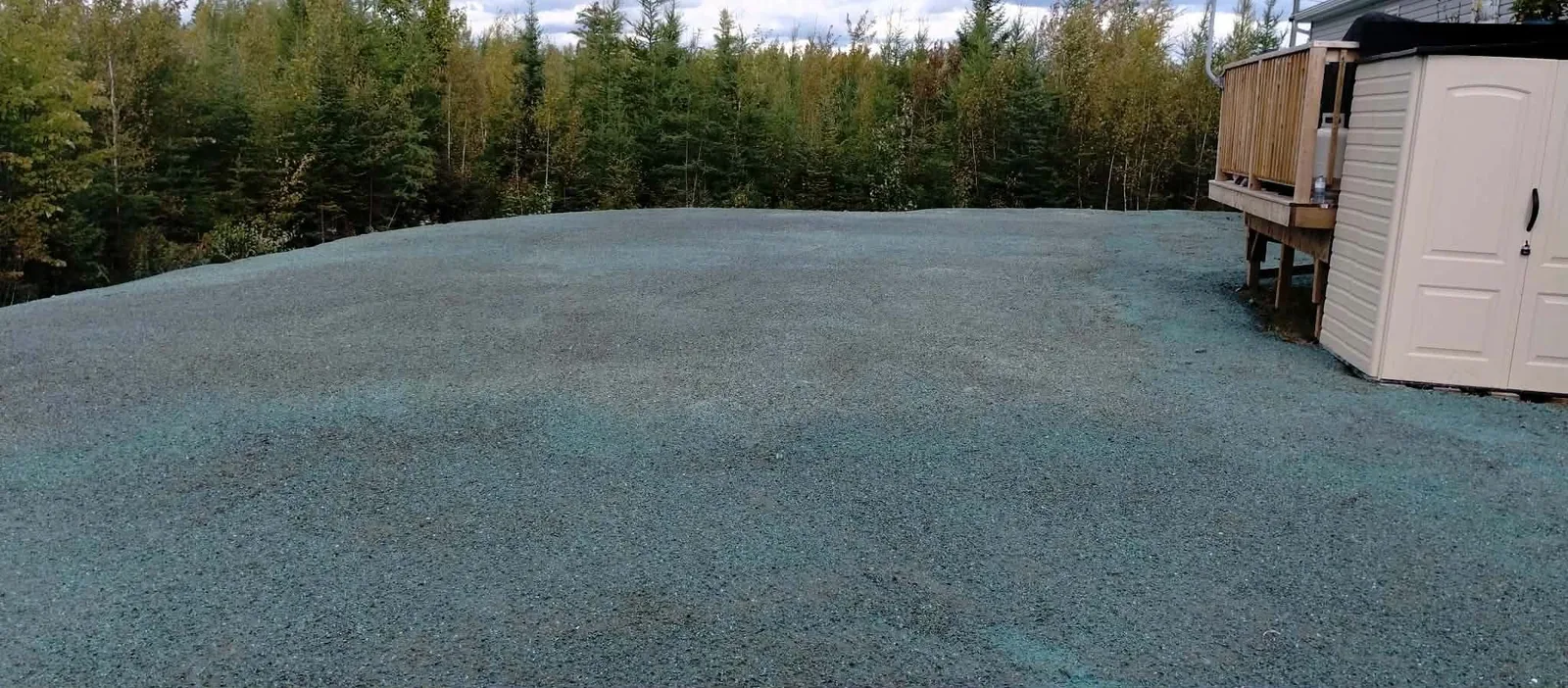Cleared and prepared Rusagonis yard at the end of the project, with hydroseed applied