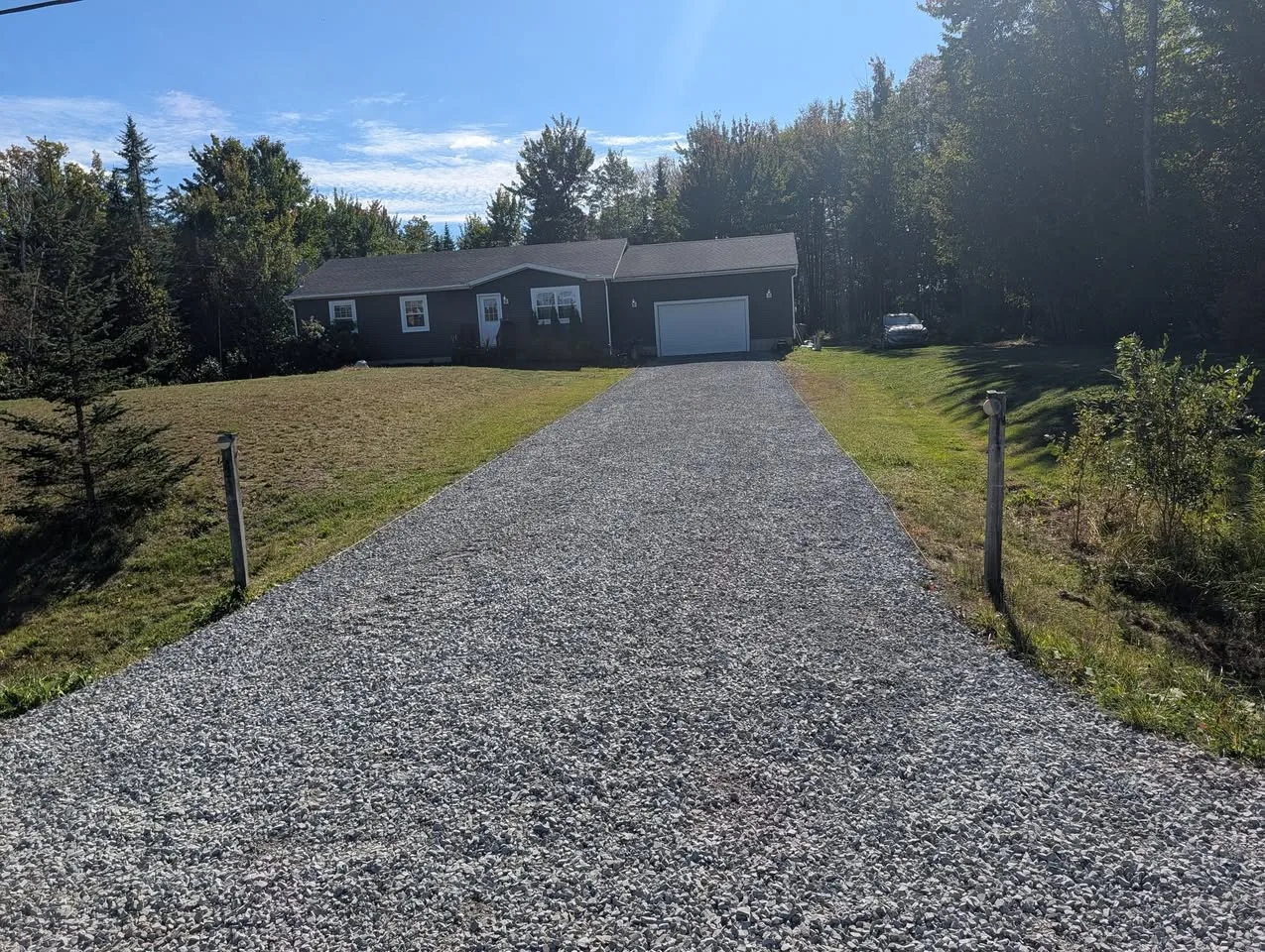 Driveway after reconstruction with fresh crushed rock